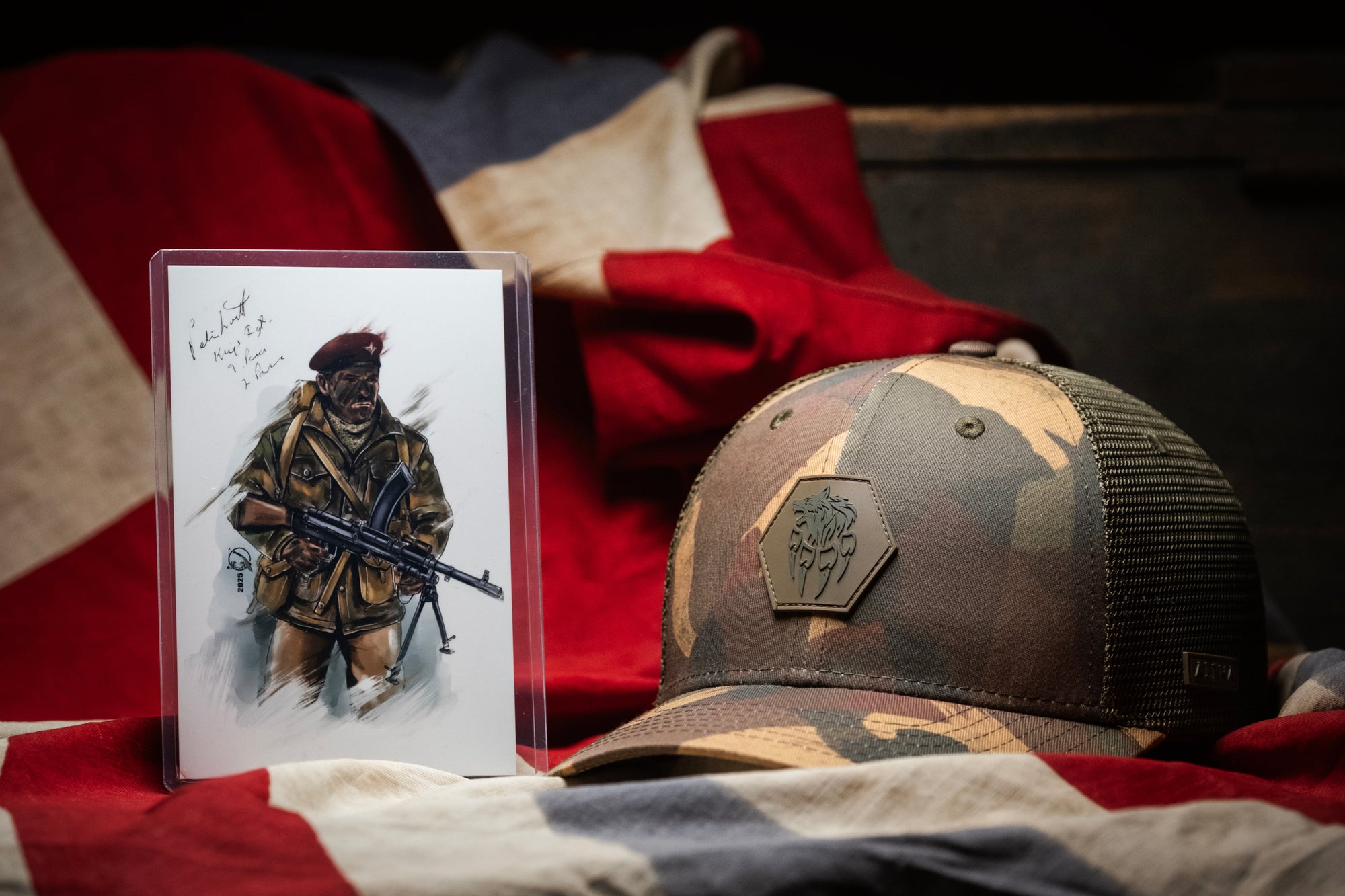Camouflage Alpha Geir Dennison trucker cap with AG logo and Artwork on a Union Jack flag background